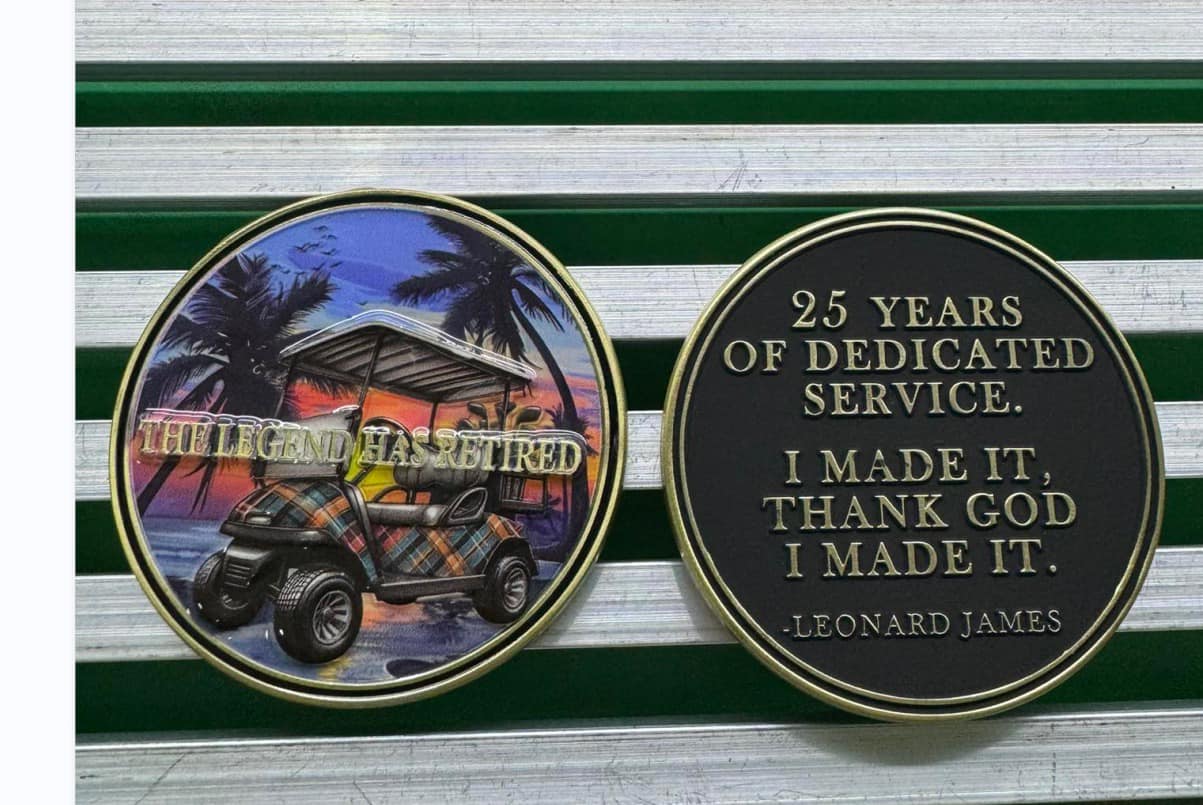 A pair of commemorative coins with the words " 2 5 years of dedication service ".