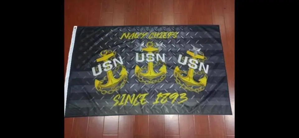 Black and gold Navy flag with anchors.