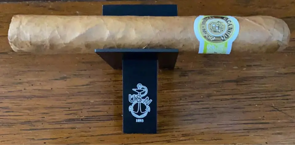 USN cigar rest with anchor logo.