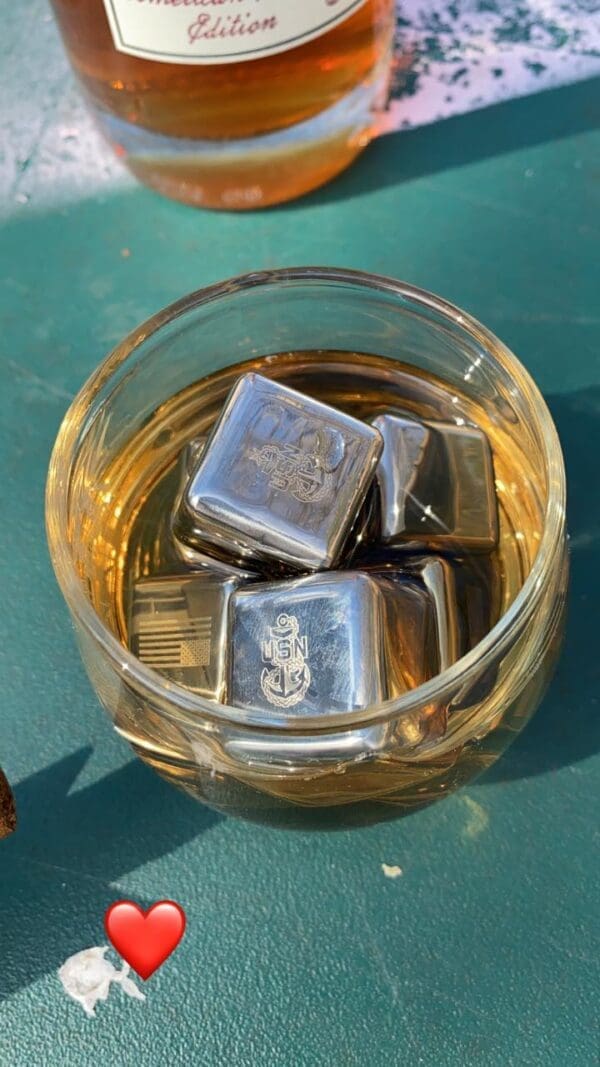 Glass of whiskey with US Navy ice cubes.