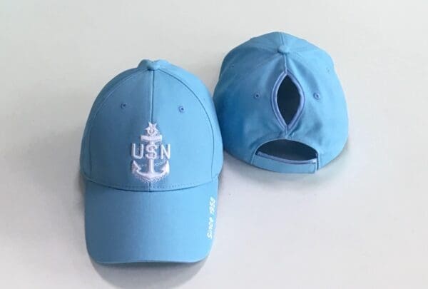 A blue hat with an anchor on it.