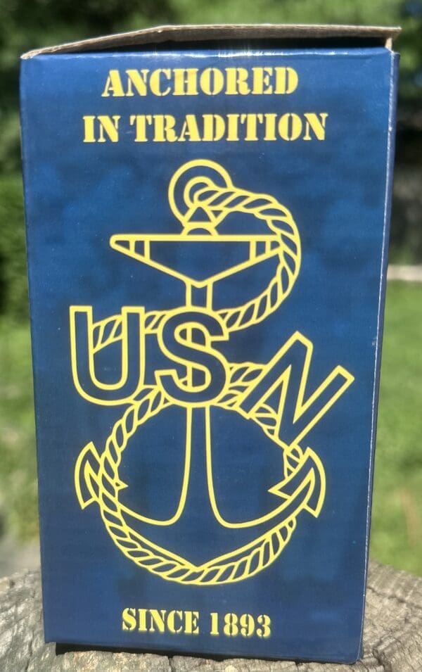 US Navy anchor logo on blue background.